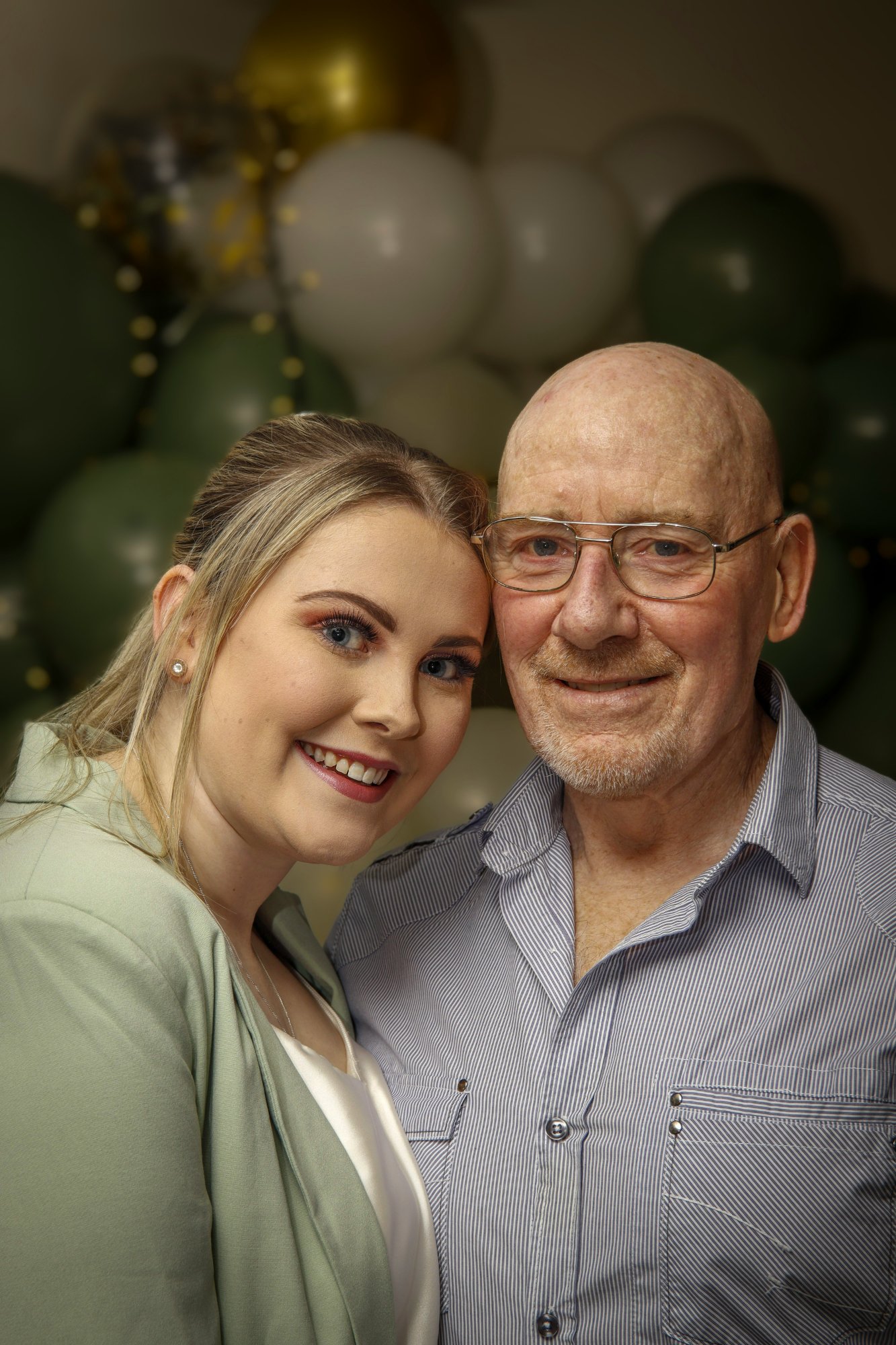 A granddaughter and her grandfather together